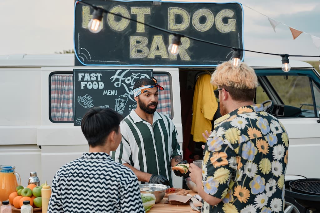 Customers at hot dog food truck